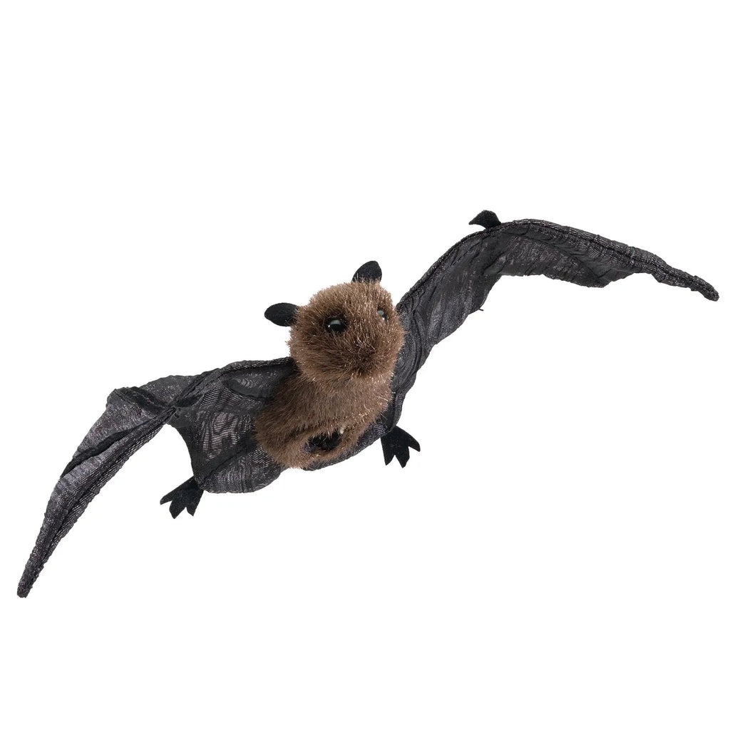 A plush bat toy with a fuzzy brown body and detailed black wings is shown against a white background, appearing in mid-flight. The mood is playful and whimsical.