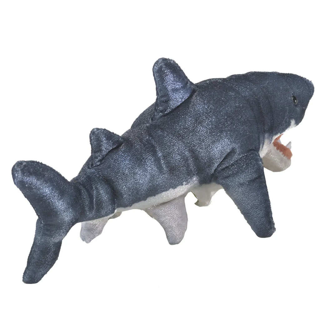 A plush shark toy with a blue-gray body and white underside, featuring three fins and an open mouth, conveying a playful and friendly appearance.