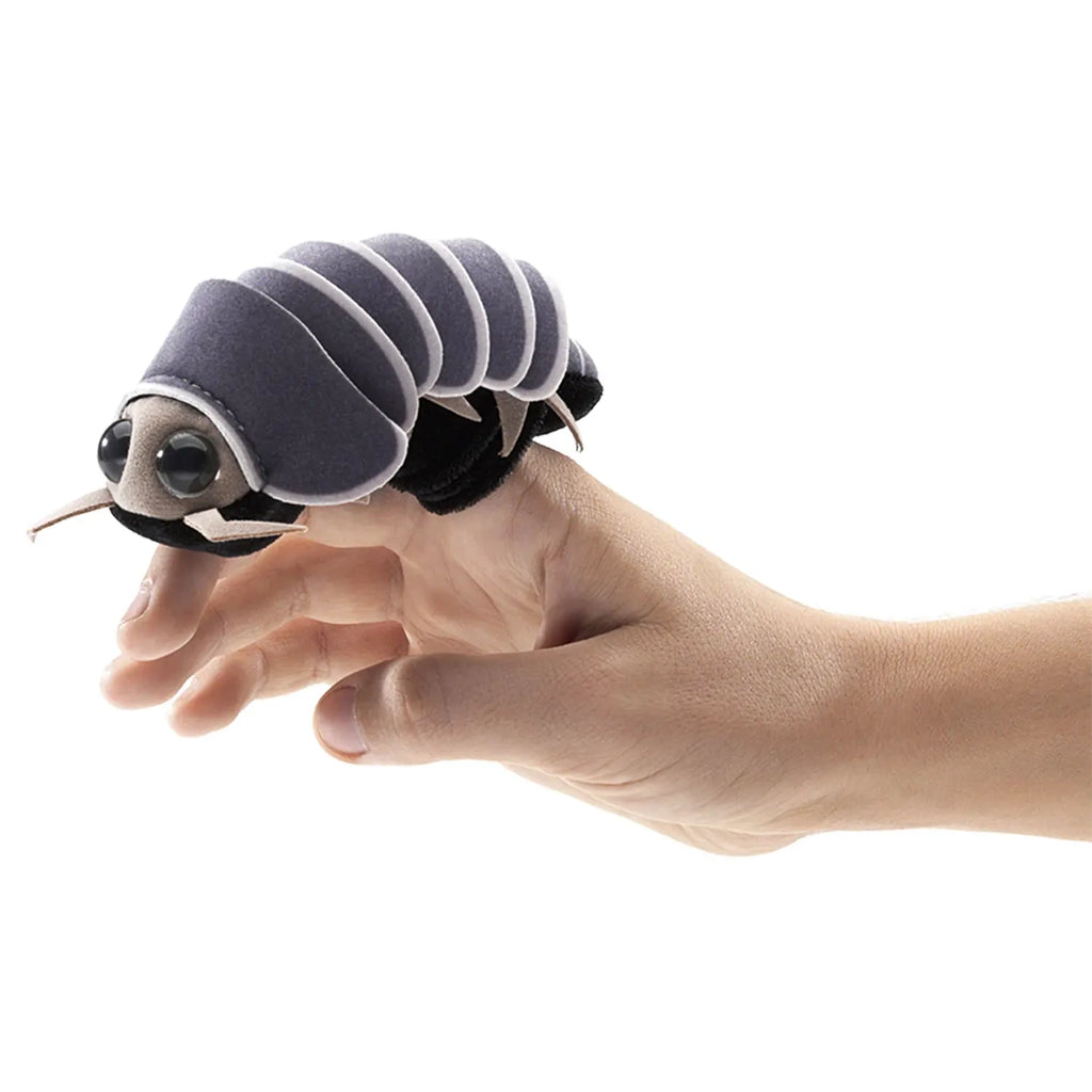 A hand holding a cute plush toy in the shape of a gray pill bug, featuring soft layered segments and large, expressive eyes, conveying a playful tone.