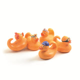 Djeco Fishing Ducks bath toy set of 5 character rubber ducks with crown sailor cap goggles and bow accessories.