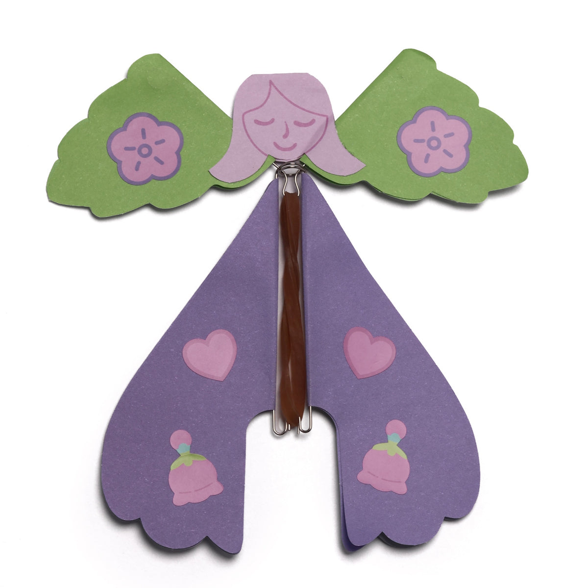 Assembled purple paper fairy toy with green wings and rubber band flying mechanism.
