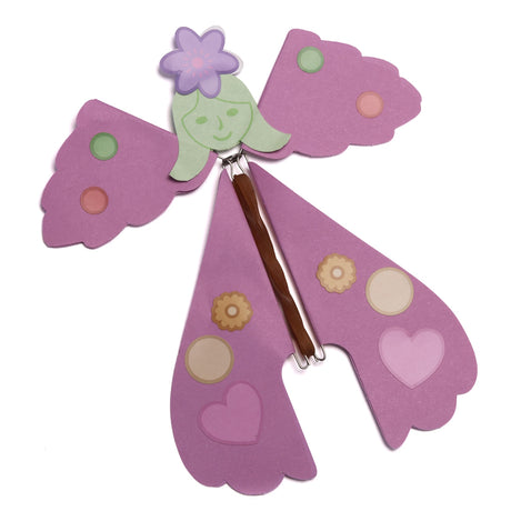 Pink paper flying fairy toy with green hair and a purple flower on top of its head.