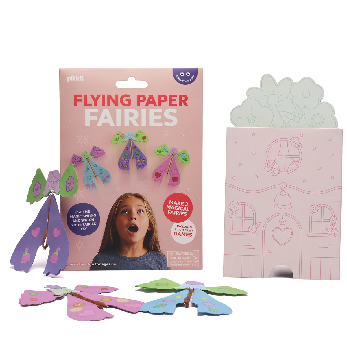 Flying Paper Fairies craft kit packaging shown with assembled paper fairies and a cardboard house.