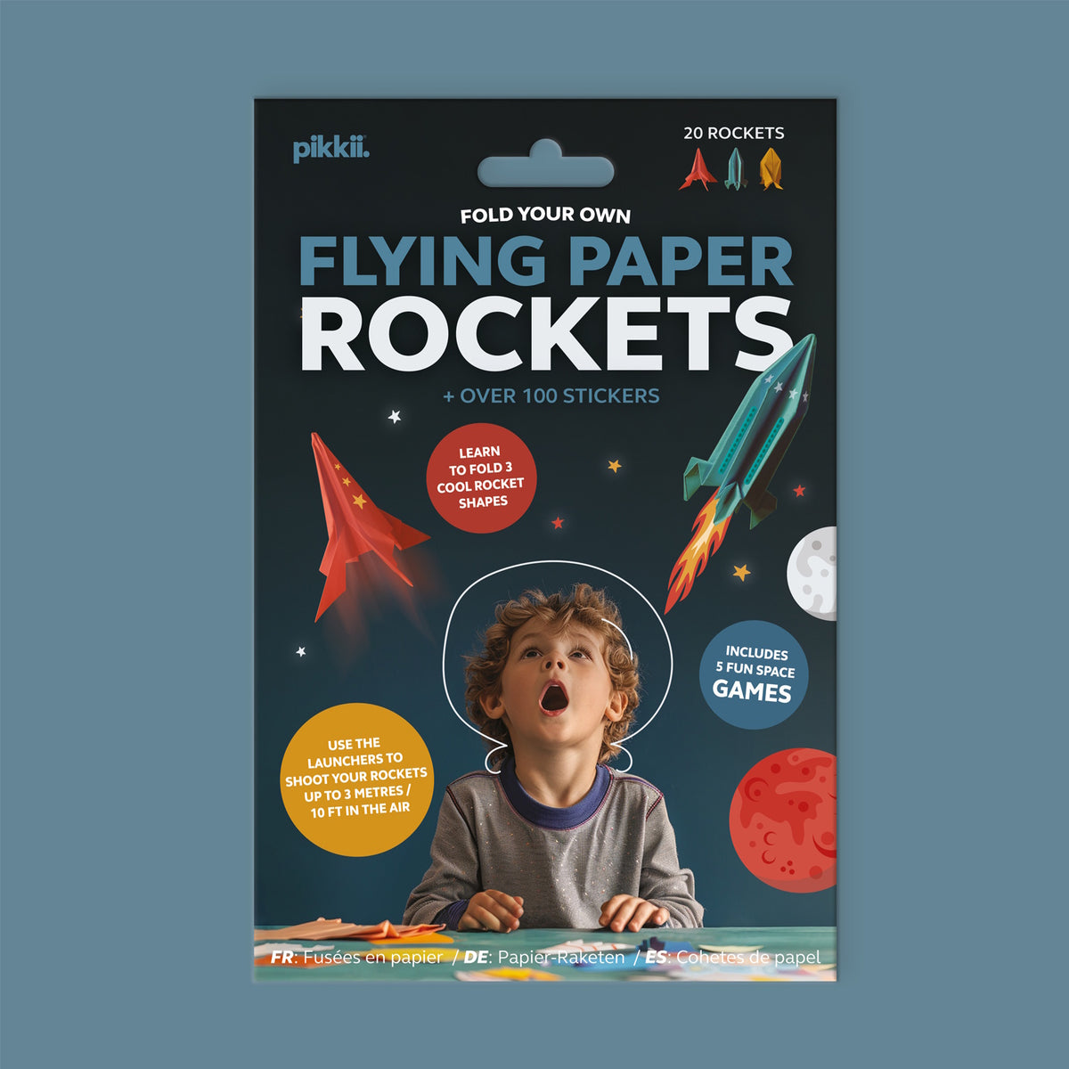 Flying Paper Rockets kit front packaging featuring a boy looking up at flying paper rockets.