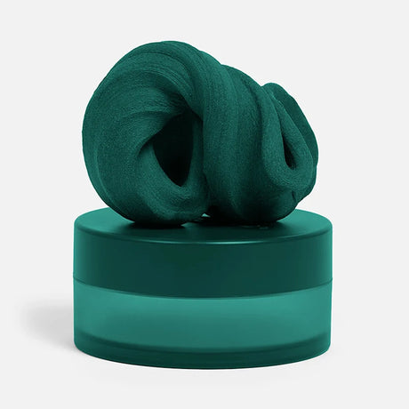 Swirled dark-green focus putty sitting on top of its matching circular container.