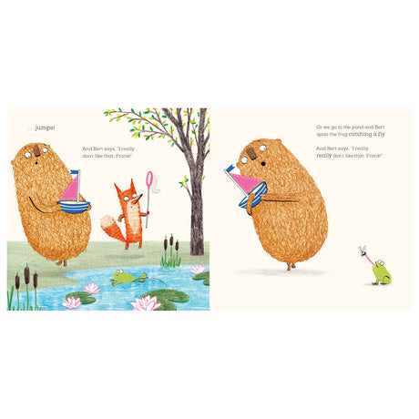 Two pages from a children's book showing a fluffy creature holding a toy boat by a pond with a fox and a frog. The scene is playful and lighthearted.