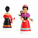 Two colorful figurines on a black background represent a woman with traditional attire, adorned with flowers, a monkey on her shoulder, and a blue butterfly.