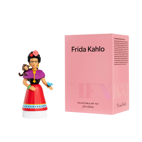 A colorful Frida Kahlo figurine, with a monkey on her shoulder and a butterfly in hand, stands beside a pink box labeled "Frida Kahlo, Collectable Art Toy."