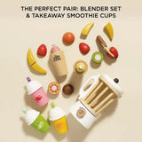 Wooden toy blender set with takeaway smoothie cups, velcro fruits, and a toy knife on a neutral background.