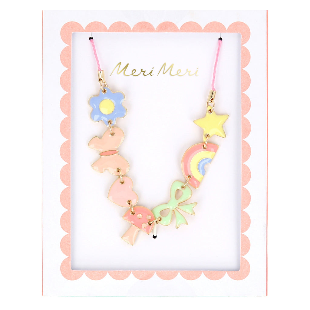 A playful gold-tone necklace featuring colorful enamel charms like a star, rainbow, and heart, perfect for fun and stylish accessorizing.