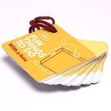 Yellow card deck titled "100 Fun Things To Do With a box" held together by a red binder ring.
