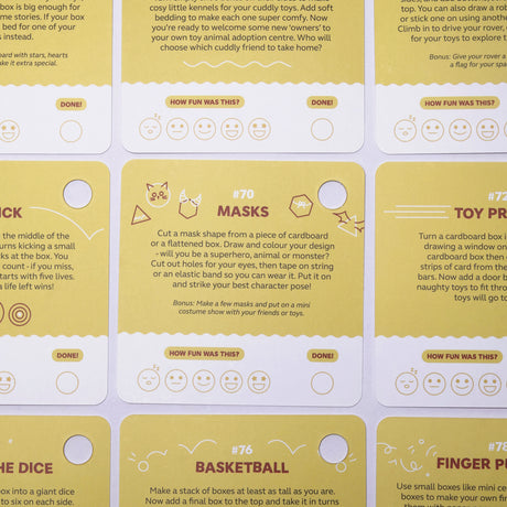 Yellow activity cards laid flat with creative ideas for kids using cardboard boxes.