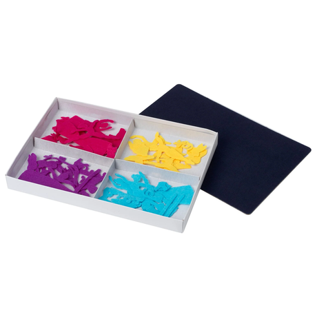A box holds colorful felt cutouts in four sections: pink, purple, yellow, and blue. Nearby, a black surface hints at a creative, playful scene.