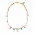 Garden Collection Camelia necklace with pastel beads, gold accents, bunny, flower, and leaf charms.