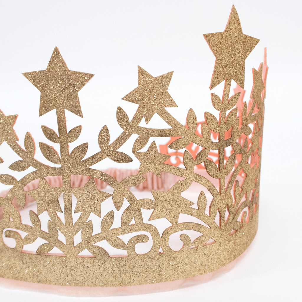 A soft fabric crown adorned with glittery stars, perfect for dress-up, parties, or magical celebrations.