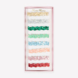 Meri Meri wavy glitter hair clips set packaging in an array of colorful shades.