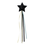 Black glittery star magic wand featuring trailing ribbons on a plain black background.