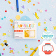 Glo Pals ABC & 123 Fun Fillers set surrounded by colorful letters, numbers, and school-themed trinkets.