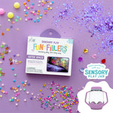 Glo Pals Outer Space Sensory Play Fun Fillers box surrounded by colorful stars and glitter trinkets.