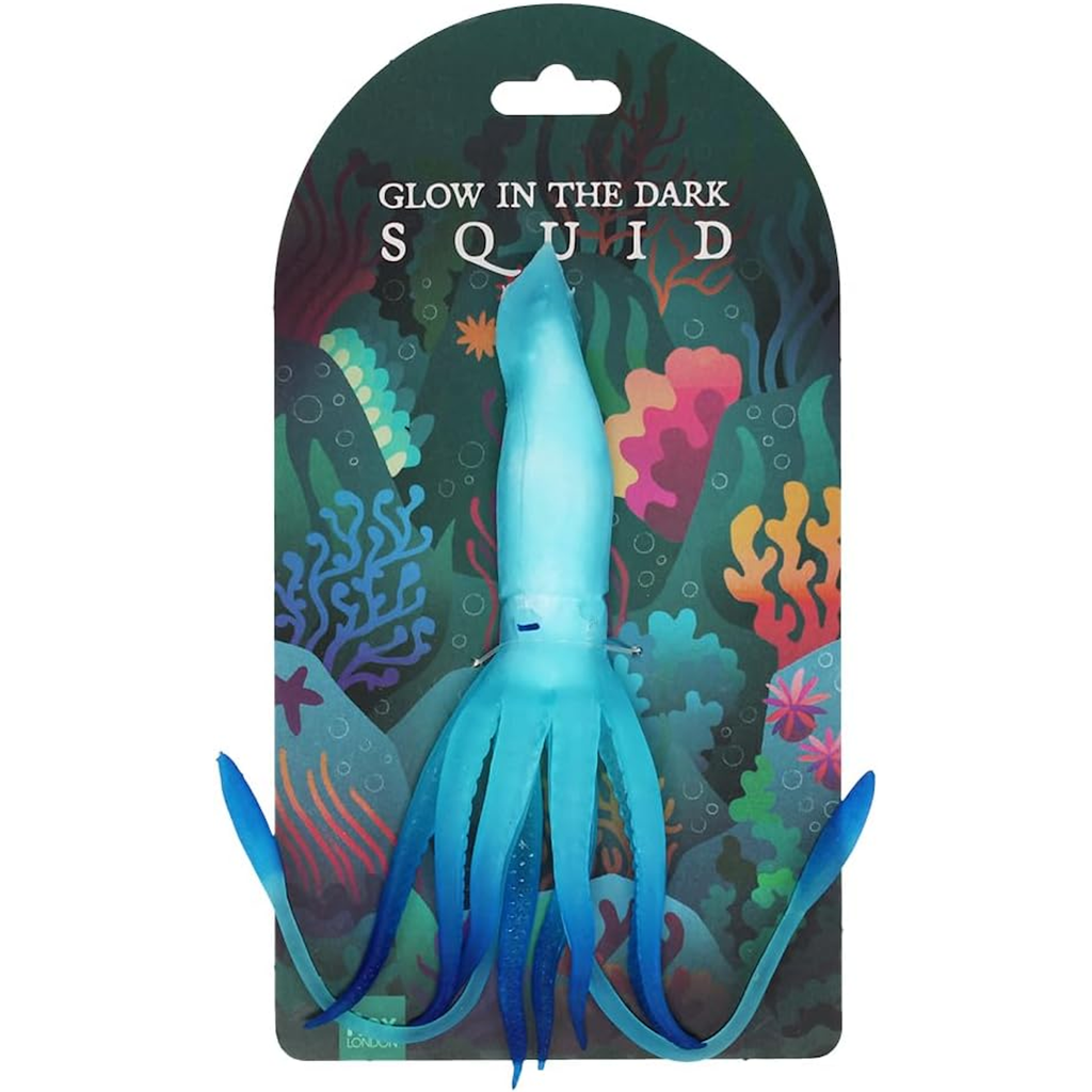 Glow-in-the-dark blue squid toy on a colorful, ocean-themed cardboard backing, featuring vibrant coral illustrations in shades of green, pink, and orange.