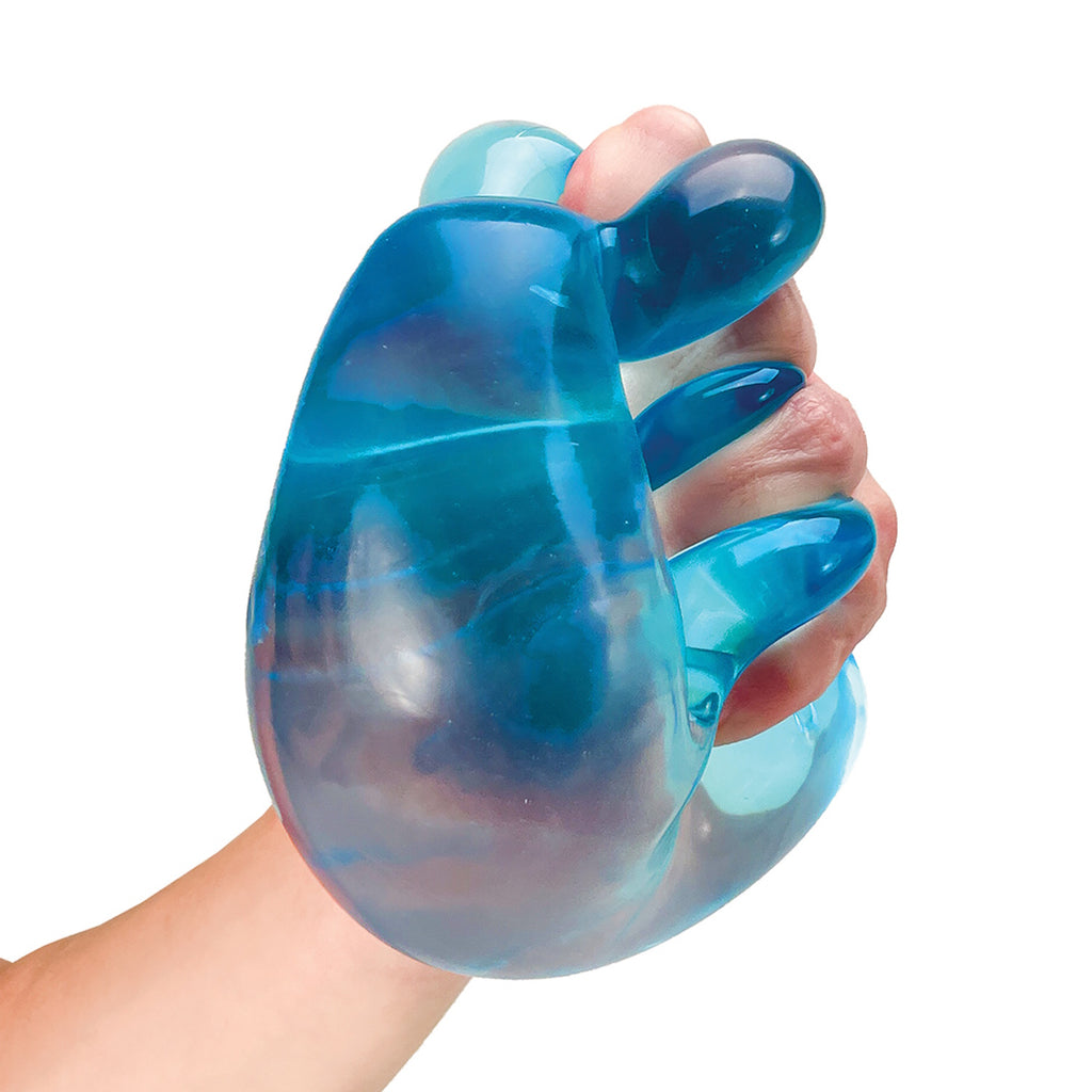 A hand squeezes a glossy, translucent blue stress ball with a marbled effect. The image conveys a sense of relaxation and tactile satisfaction.