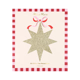 Meri Meri gold glitter star decoration package with a pink bow and red checkered border.