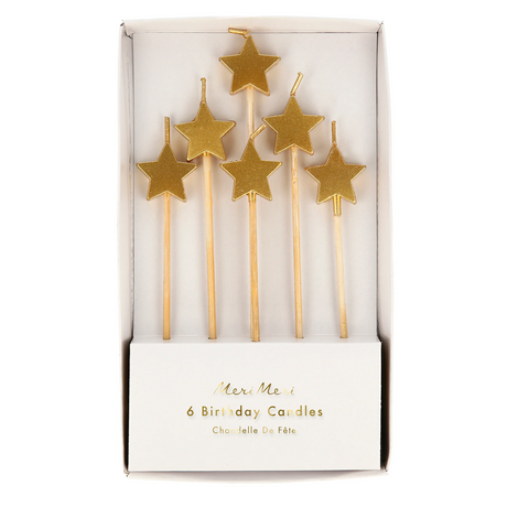 A set of shimmering gold star-shaped candles on sticks, perfect for adding a touch of sparkle to cakes and celebrations.