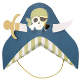 A blue paper pirate party hat with a skull emblem wearing a green bandana and a cutout sword.