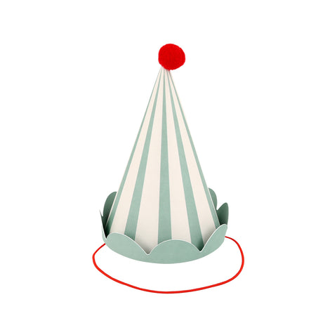 A striped green and white cone party hat with a red pom-pom on top and a red elastic strap.