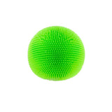 A bright green, fuzzy sensory ball covered in soft rubber spikes against a plain white background.