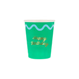 Green paper cup with a light blue wavy line and "Happy Birthday" written in gold script font.