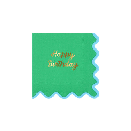 A green square napkin with a blue wavy border and gold script text that reads "Happy Birthday".