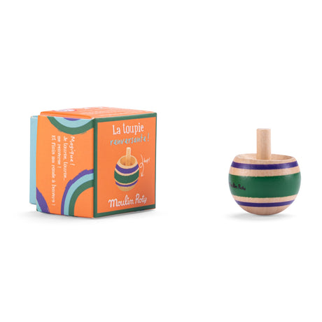 Moulin Roty green wooden spinning top toy next to its colorful orange packaging box on a white background.