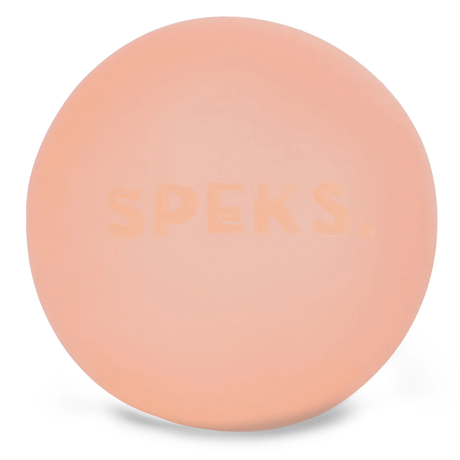 Peach-colored round object with the word "SPEKS" subtly embossed on its surface. The smooth texture and soft color create a calming effect.