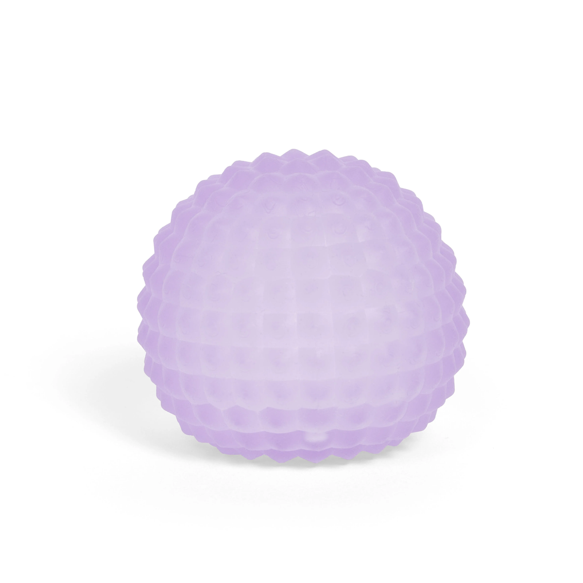 A lavender, textured massage ball with a dimpled surface, set against a plain white background. The soft hue conveys a calming, therapeutic vibe.