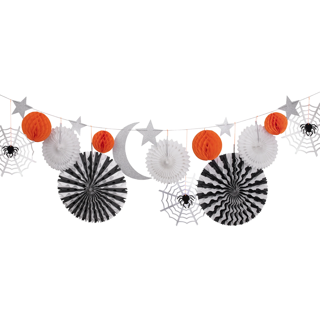 Halloween-themed garland with orange and white paper lanterns, black and white pinwheels, and silver stars. Includes spiderwebs and sparkly crescent moon.