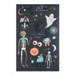 Meri Meri Halloween temporary tattoo sheet with spooky icons like skeletons, a ghost, and a black cat.