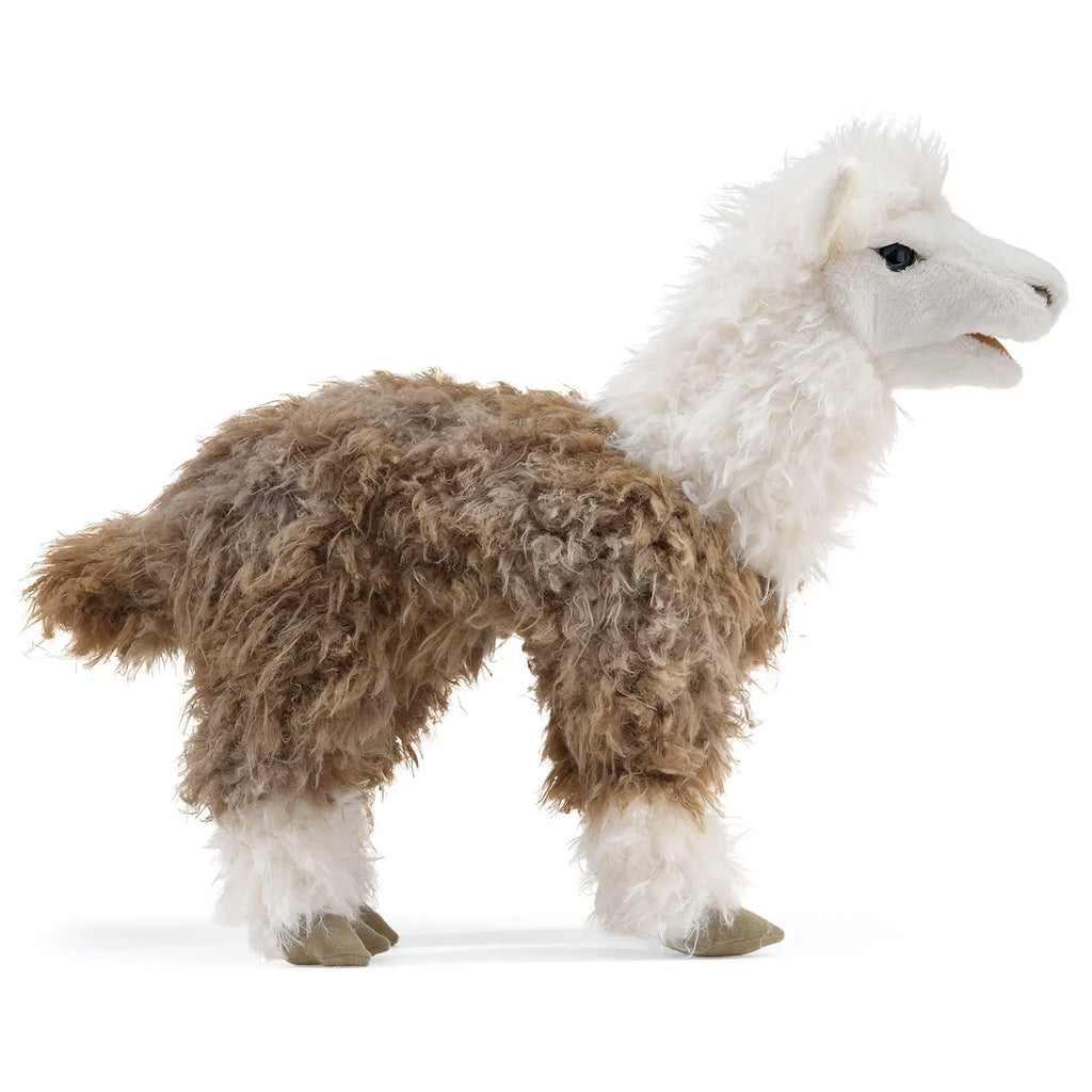 A plush llama toy with fluffy brown and white fur stands on a white background. The toy's soft texture and friendly expression convey a playful tone.