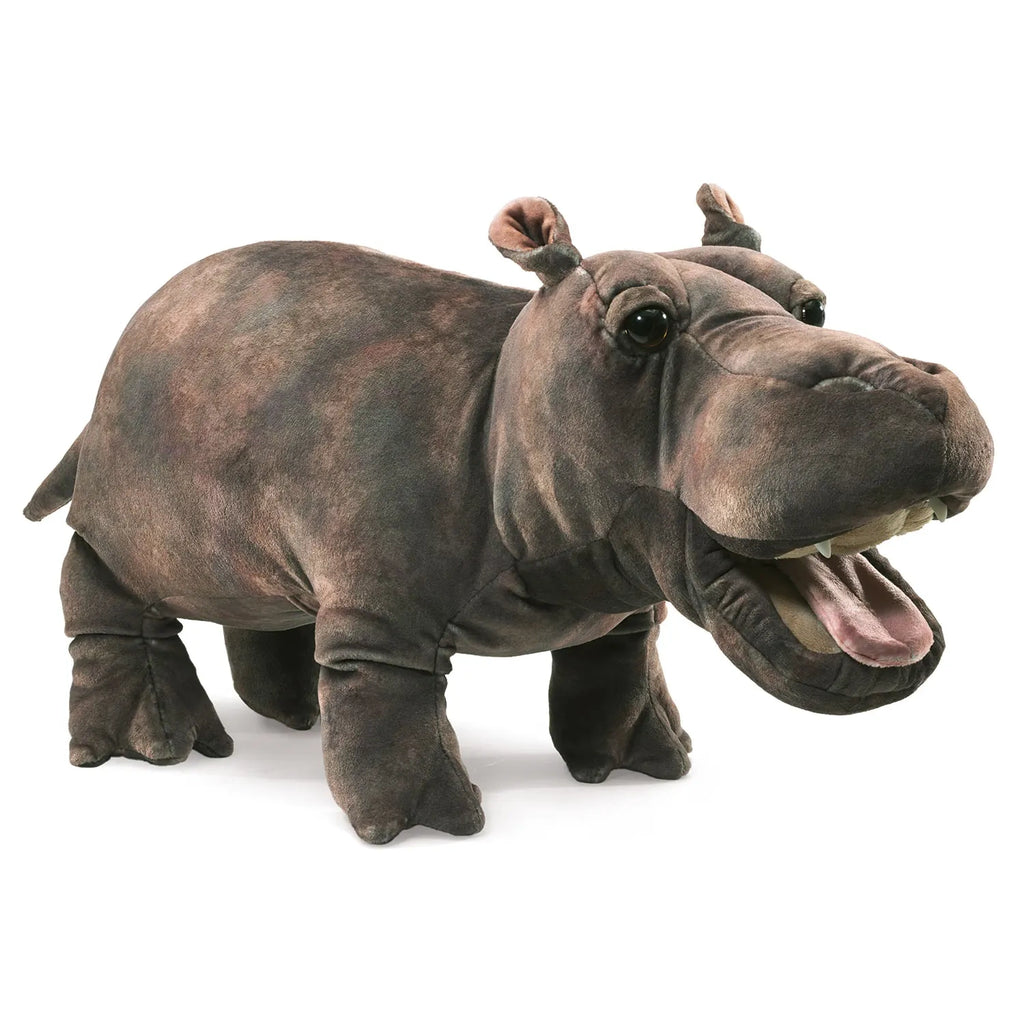 Realistic plush hippo toy with a dark brown texture, open mouth, and detailed features. The hippo stands on four legs, conveying a playful tone.