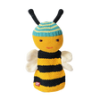 Smiling knitted bee toy with a striped yellow and black body, blue and yellow head with antennae, and white wings, on a white background. Cheerful tone.
