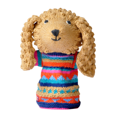 Knitted dog puppet with curly ears, wears a colorful sweater with geometric patterns in orange, blue, pink, and teal, set against a white background.