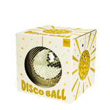 A gold mirror disco ball inside its white and gold illustrated box on a white background.