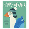 Cover of "Hank Meets Frank," featuring a white goose wearing a striped blue hat and a blue bird against a teal background, with an amusing tone.