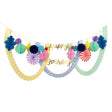 Festive party garland featuring gold script "Happy Birthday" text, colorful paper honeycomb balls, and tissue streamers.