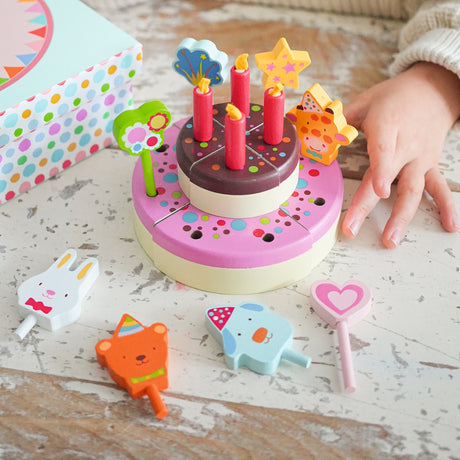 Wooden birthday cake toy with red candles and animal toppers for pretend play and toddlers.