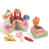 Colorful wooden rainbow birthday cake toy set with candles and animal toppers for pretend play.