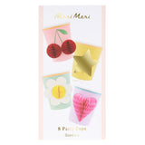 Meri Meri packaging for an 8-pack of party cups featuring colorful designs with 3D honeycomb details like cherries, stars, flowers, and hearts.