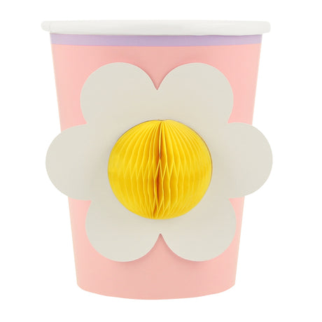 Pink Meri Meri party cup featuring a white flower with a 3D yellow honeycomb center.