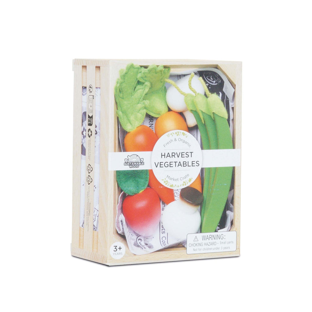Box of toy vegetables labeled "Harvest Vegetables," featuring wooden replicas of assorted produce. Packaging states "Sustainable Wood" and "3+ Years."