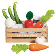 Wooden toy vegetable set in a Le Toy Van crate with a carrot and mushroom sitting in front.